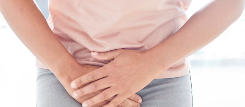 Pelvic congestion syndrome woman holding her lower stomach in pain