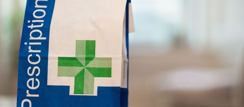 The picture shows a paperbag with the word "prescription" written on it. This is for the article, what is the HRT pre-payment certficiate.